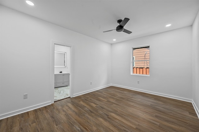 unfurnished room featuring dark wood-type flooring and ceiling fan