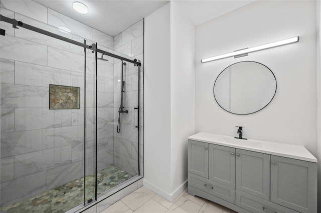 bathroom featuring vanity and an enclosed shower