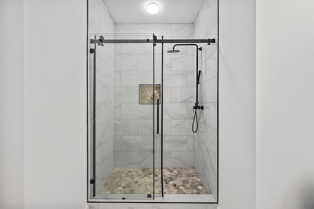 bathroom featuring an enclosed shower