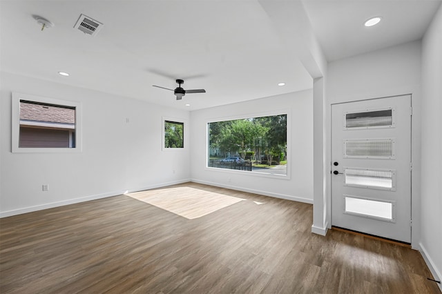 interior space with dark hardwood / wood-style flooring and ceiling fan