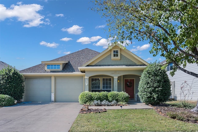 view of front of property with a front yard, a garage, and a porch