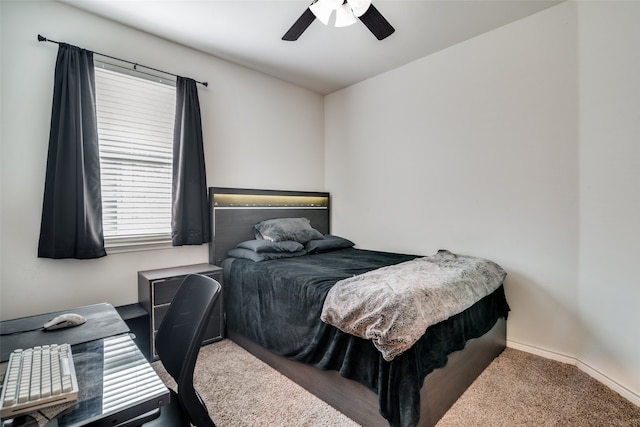 bedroom featuring ceiling fan and carpet