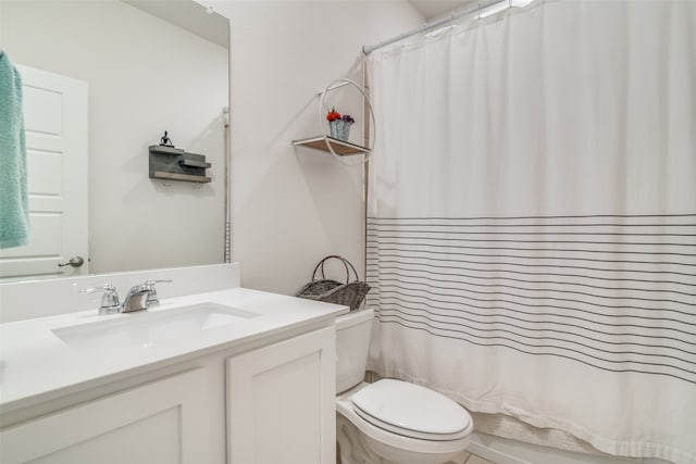 full bathroom featuring vanity, toilet, and shower / bath combination with curtain