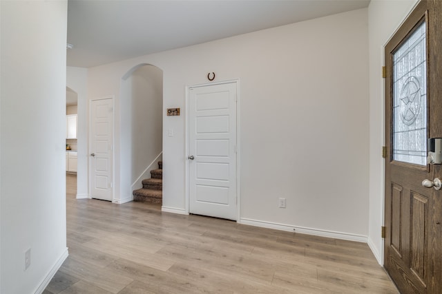 entrance foyer featuring light wood-type flooring and a wealth of natural light