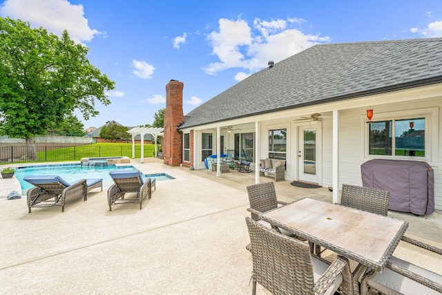 view of patio with ceiling fan and a fenced in pool