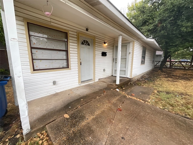 entrance to property featuring a patio area