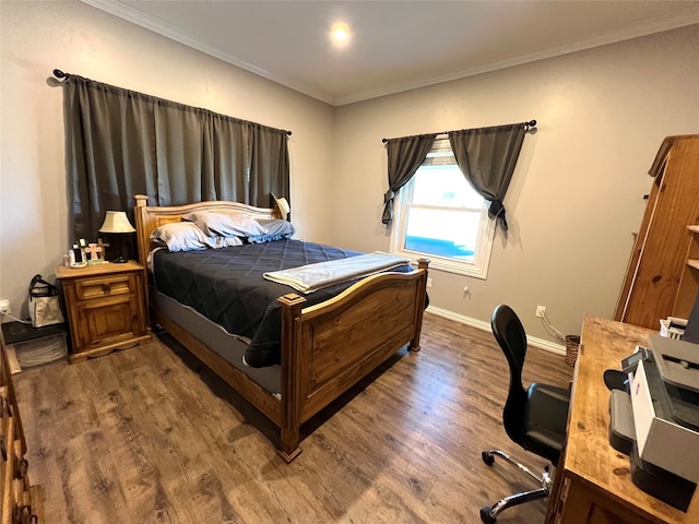 bedroom with ornamental molding and wood-type flooring