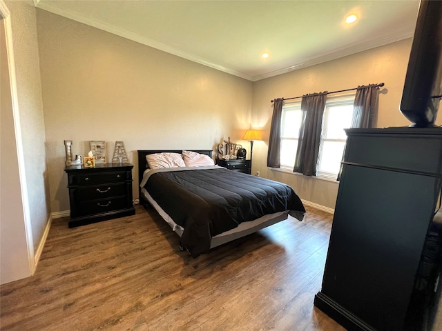 bedroom featuring hardwood / wood-style flooring and ornamental molding