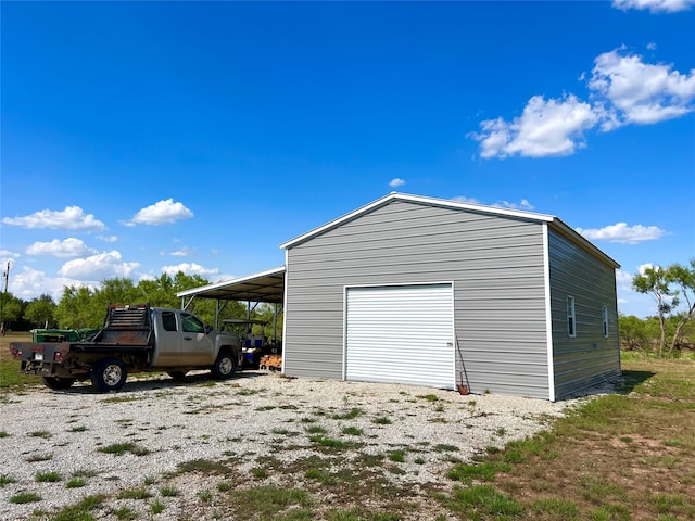 garage featuring a carport