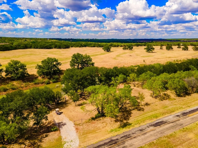 birds eye view of property with a rural view