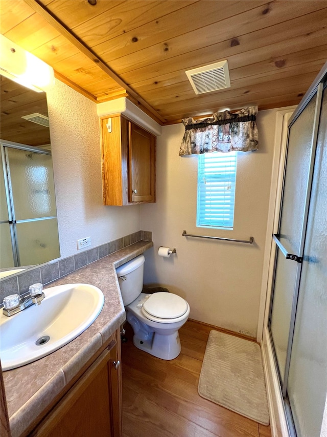 bathroom featuring vanity, wooden ceiling, hardwood / wood-style floors, walk in shower, and toilet