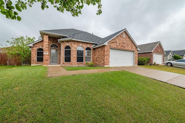 single story home with a garage and a front yard