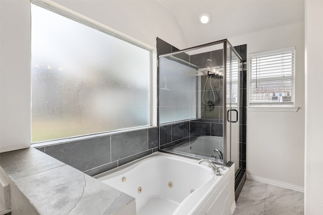 bathroom featuring lofted ceiling and shower with separate bathtub