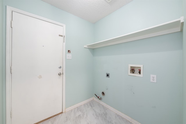 laundry area featuring washer hookup, a textured ceiling, hookup for an electric dryer, and hookup for a gas dryer