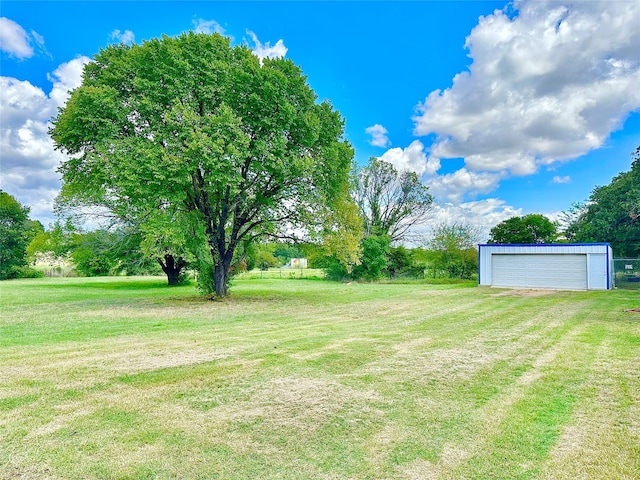 view of yard featuring a garage