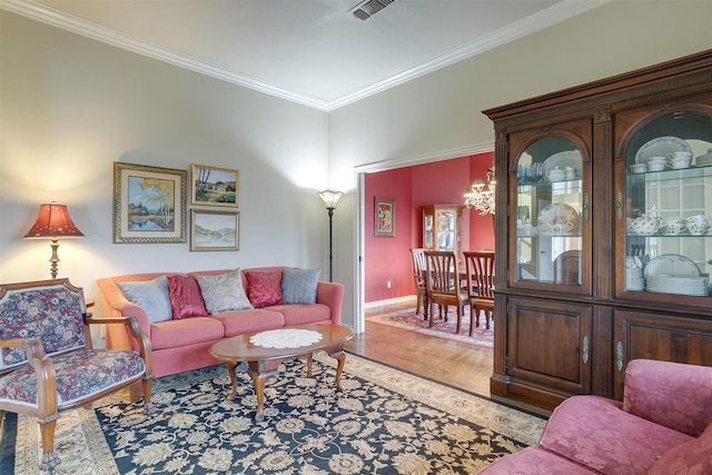 living room featuring hardwood / wood-style floors and ornamental molding