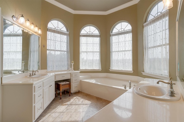 bathroom with ornamental molding, plenty of natural light, and a bathing tub