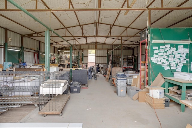 misc room with concrete floors and lofted ceiling