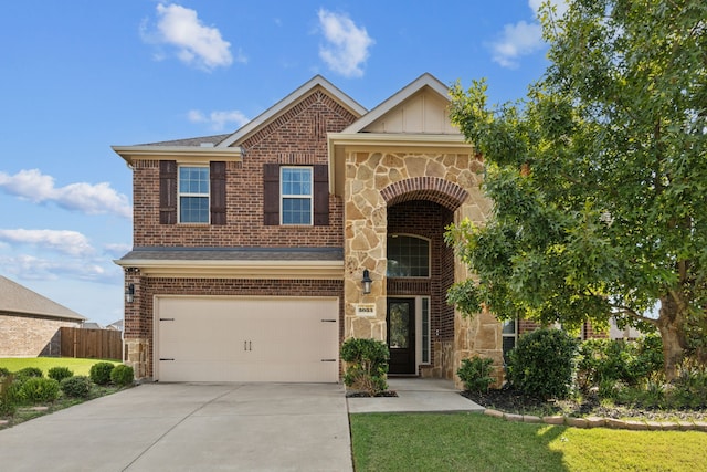 view of front of home with a garage and a front lawn