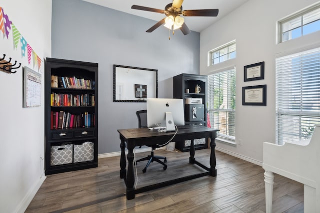 office space featuring ceiling fan and dark hardwood / wood-style floors