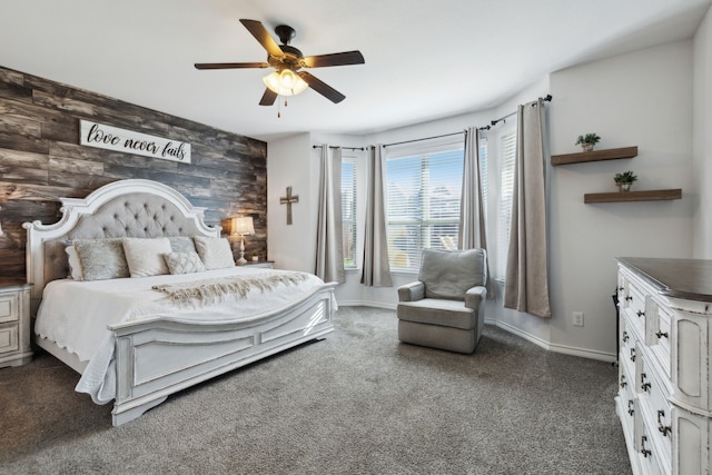 bedroom featuring ceiling fan and wooden walls