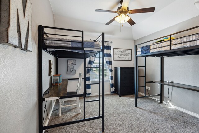 carpeted bedroom with lofted ceiling and ceiling fan