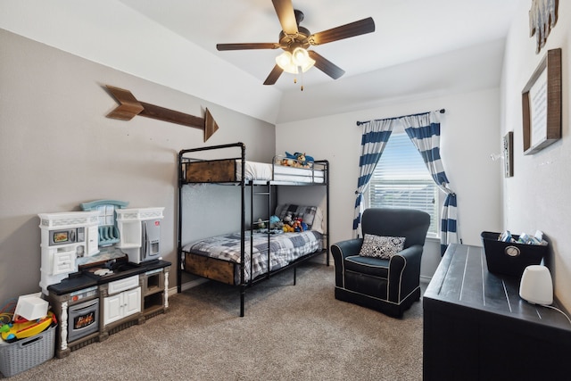 carpeted bedroom with ceiling fan and vaulted ceiling