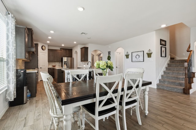 dining room with plenty of natural light and light hardwood / wood-style floors