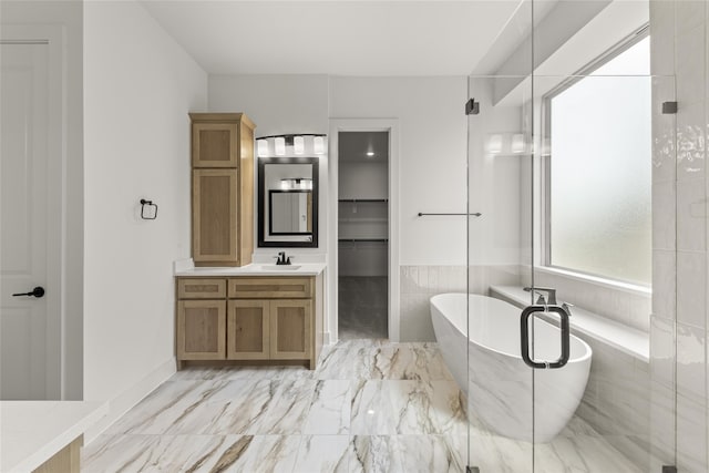 bathroom featuring independent shower and bath and vanity