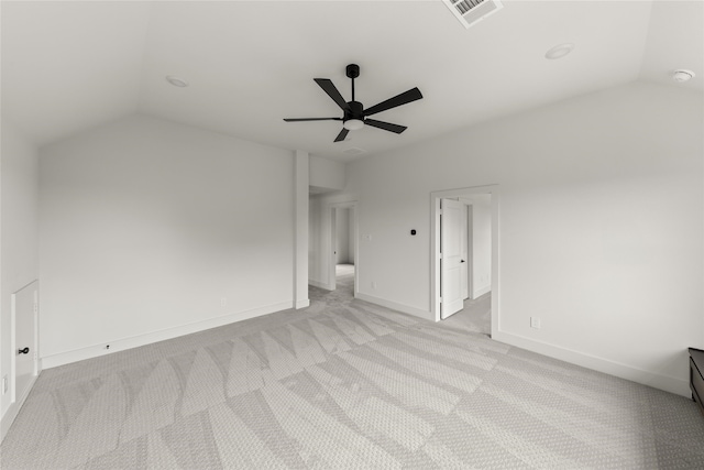 additional living space featuring light carpet, ceiling fan, and vaulted ceiling