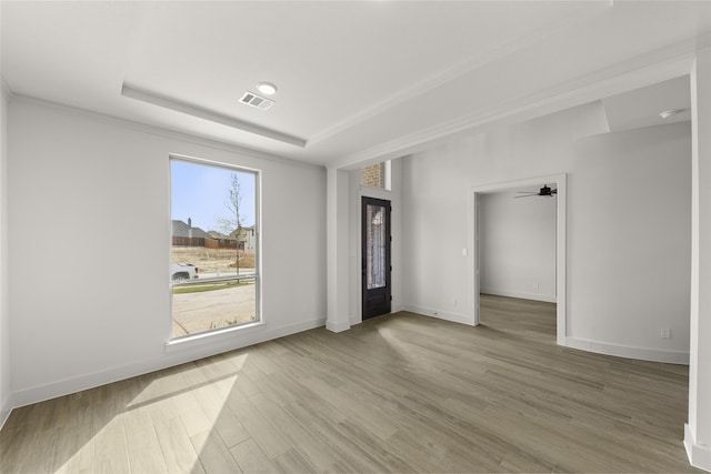 empty room with ceiling fan and light wood-type flooring