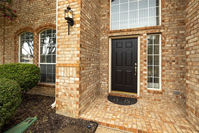 entrance to property with a patio