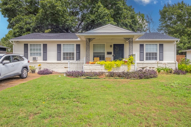 ranch-style home featuring a front yard