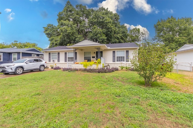 ranch-style house with a front lawn and covered porch