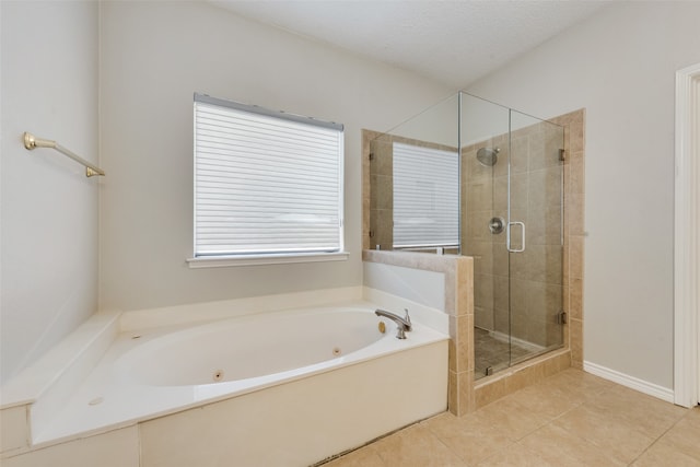 bathroom with independent shower and bath, a textured ceiling, and tile patterned floors