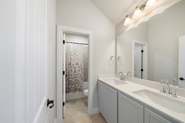 full bathroom with lofted ceiling, shower / bathtub combination with curtain, tile patterned floors, vanity, and toilet