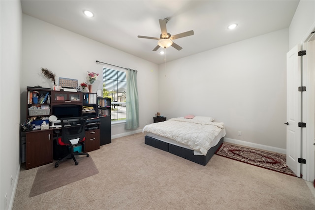 bedroom featuring light carpet and ceiling fan