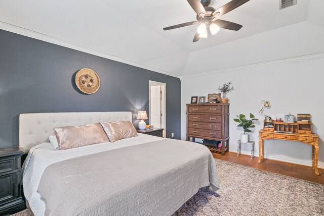 bedroom with ornamental molding, vaulted ceiling, and ceiling fan