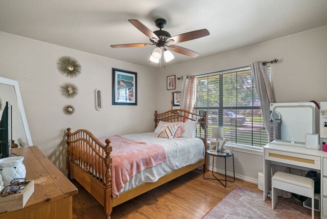 bedroom featuring ceiling fan and hardwood / wood-style flooring