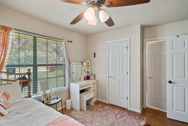 bedroom with hardwood / wood-style flooring and ceiling fan