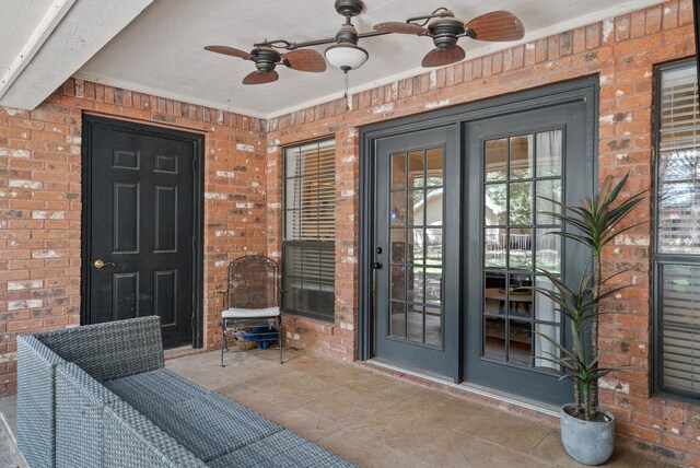 doorway to property featuring ceiling fan and french doors