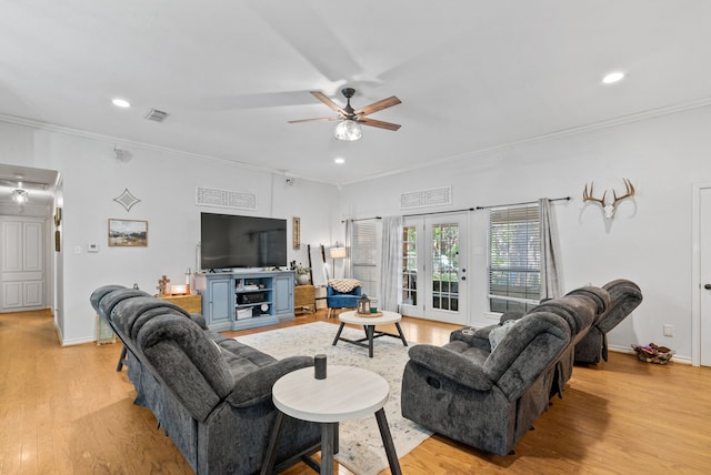 living room featuring ornamental molding, ceiling fan, and light hardwood / wood-style floors