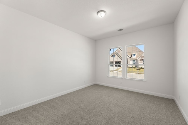 unfurnished room featuring carpet