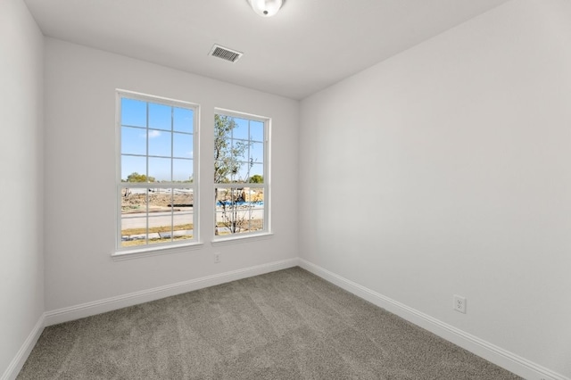 empty room featuring carpet flooring