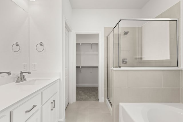 bathroom featuring vanity, separate shower and tub, and tile patterned flooring