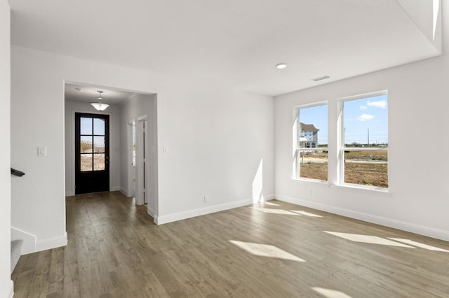 spare room featuring hardwood / wood-style floors