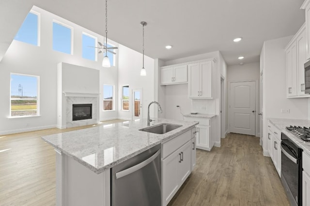 kitchen featuring white cabinets, sink, and stainless steel appliances