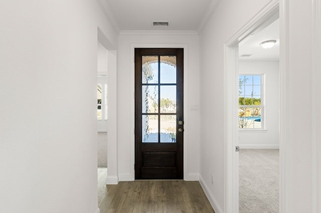 entryway featuring crown molding and hardwood / wood-style flooring