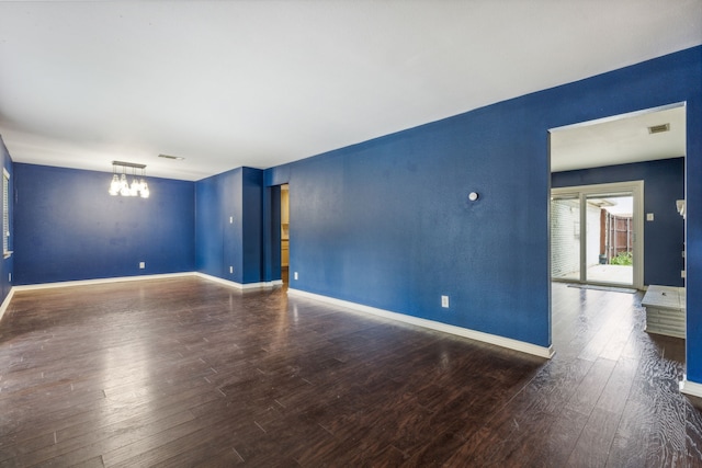 unfurnished room with hardwood / wood-style floors