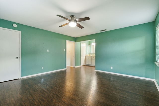 unfurnished room featuring ceiling fan and dark hardwood / wood-style floors